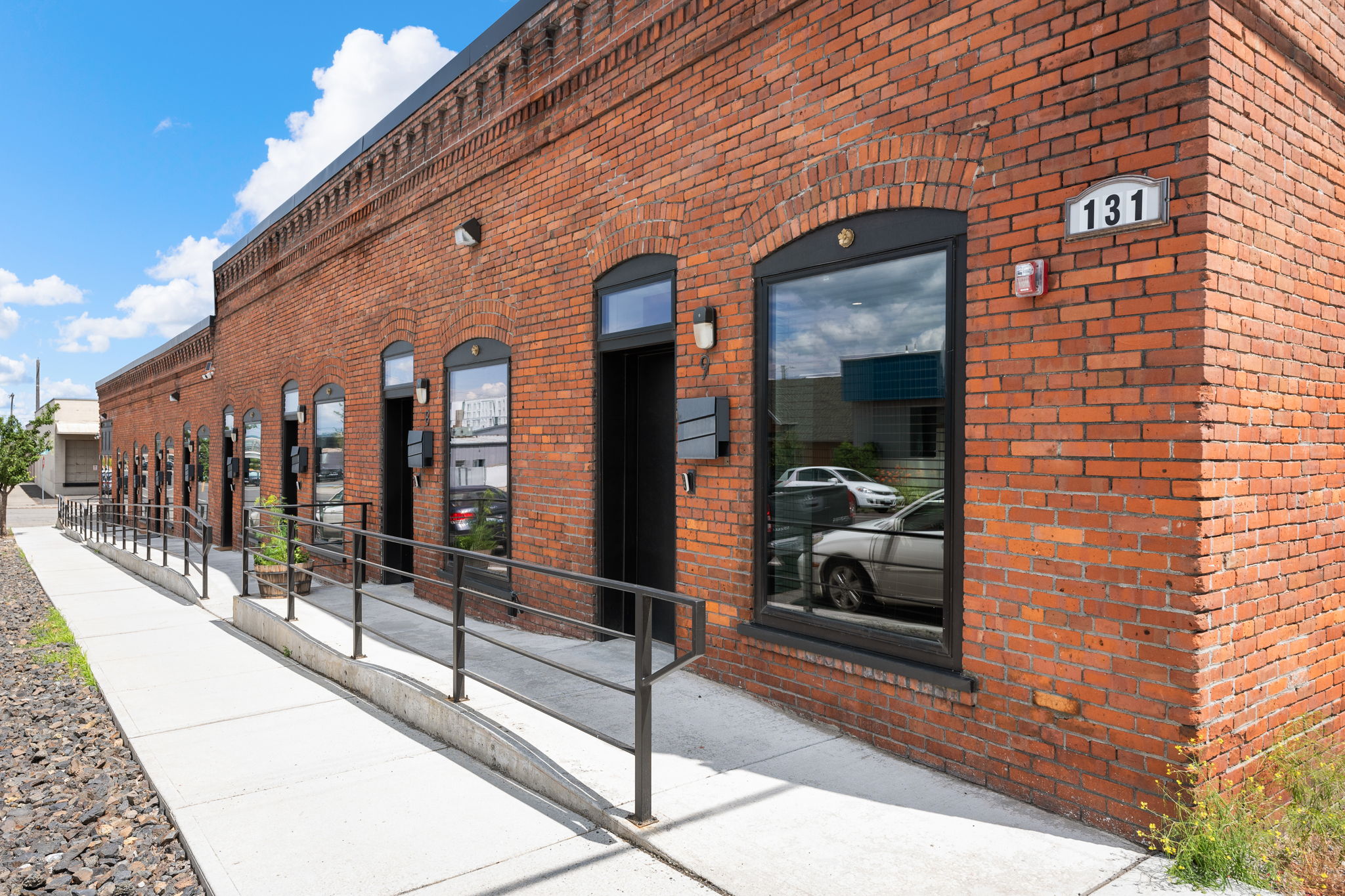 Exterior of a historic Spokane brick building in the University District, converted to multifamily apartments to help with the Spokane housing shortage